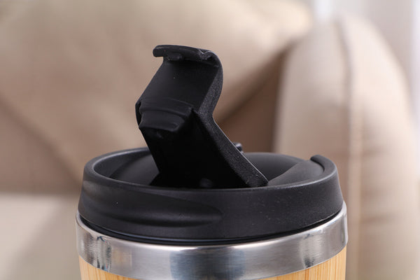 Travel cup resealable lid.