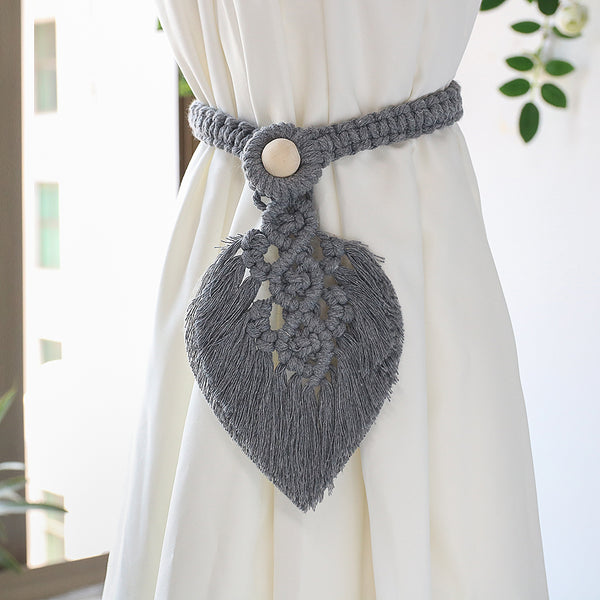Grey woven curtain tieback.