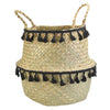 Seagrass storage basket with black tassels.