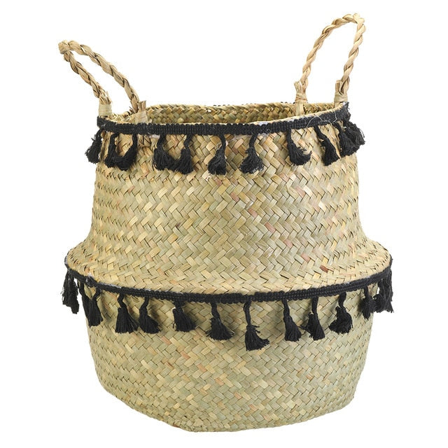 Seagrass storage basket with black tassels.