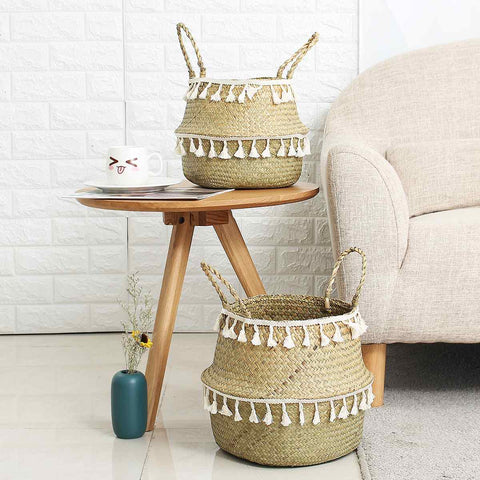 Hand woven storage baskets with white tassels.