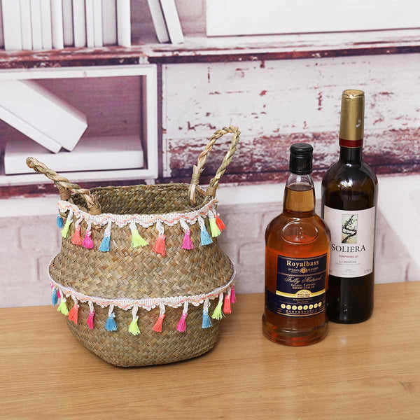 Small natural basket with colourful tassels.